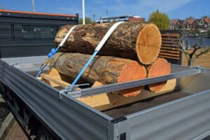 Wooden stumps on the truck. The stumps are secured by safety straps. Good protection of products in cargo area is the responsibility of the driver.